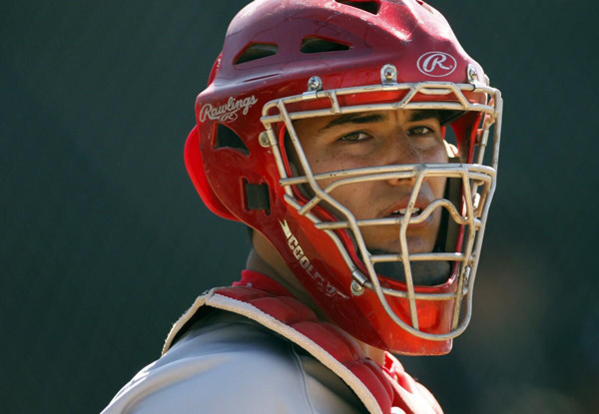 Mater Dei catcher Jeremy Martinez looks for a coaches signal during a game against Servite earlier this month in Anaheim.