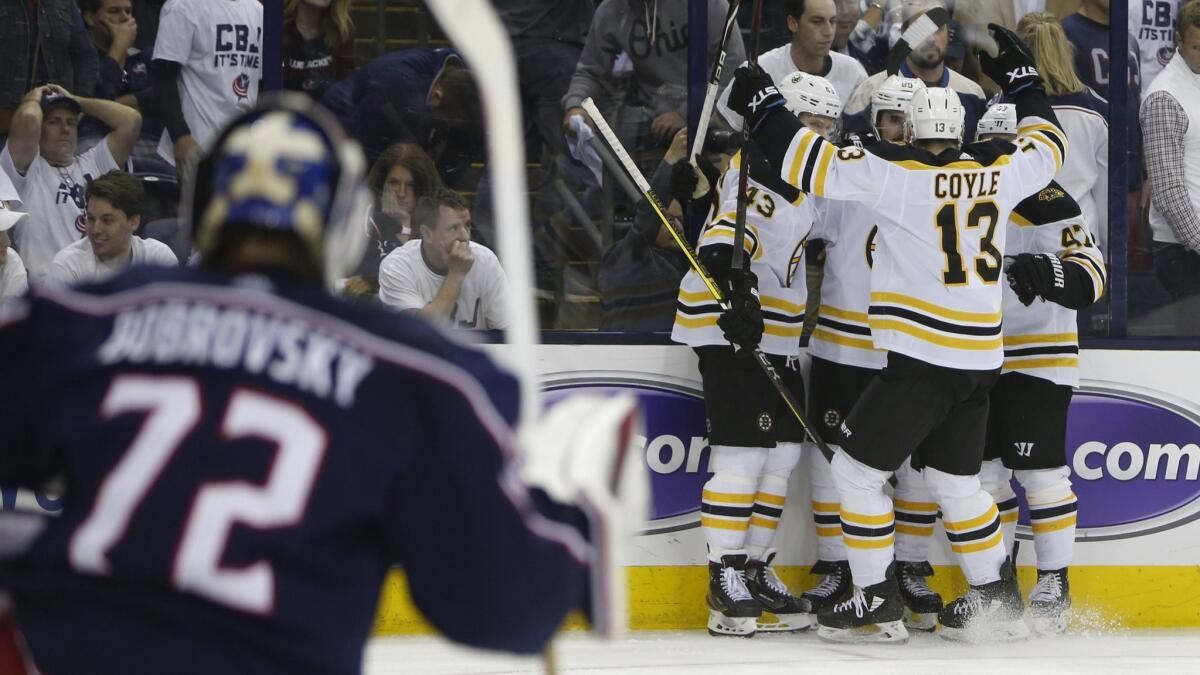 Boston Bruins players celebrate a goal against the Columbus Blue Jackets during the third period of Game 6 of the NHL Eastern Conference semifinals on May 6.