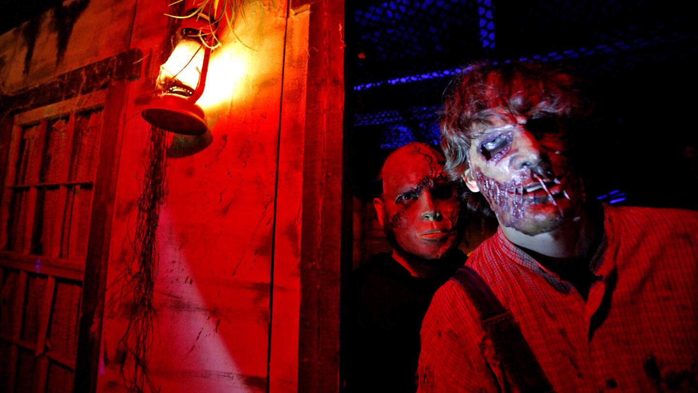 Robert Alexander, left, and Aaron Silvey are two of the frightening characters that can be found in the shadows of the Reign of Terror Haunted House.