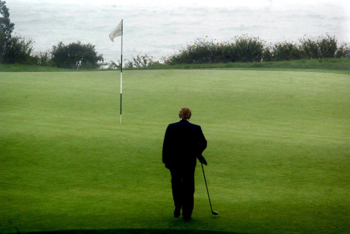 Donald Trump announced his purchase of the Ocean Trails Golf Club in Ranchos Palos Verdes in November 2002. Here, he walks toward the pin on the 11th tee as part of a portrait session.
