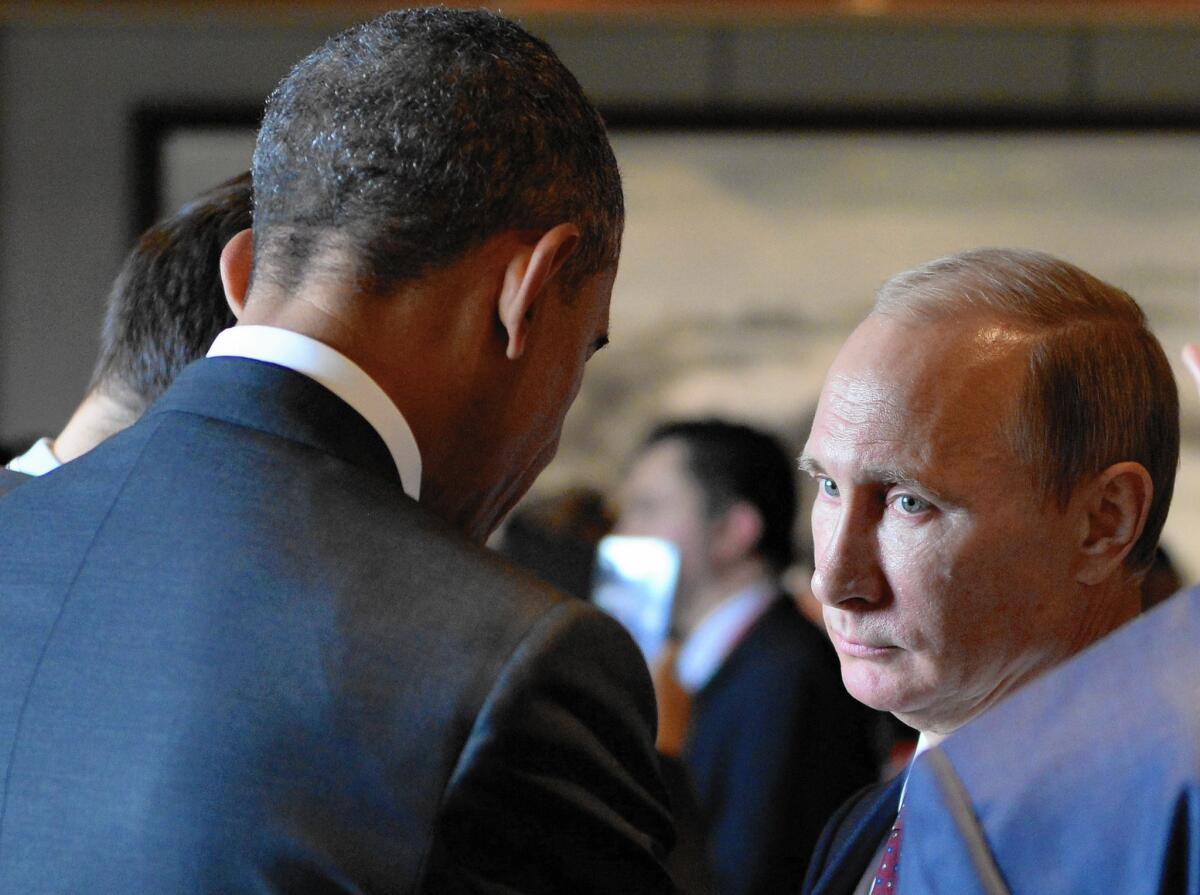 President Obama speaks with Russian President Vladimir Putin at the Asia-Pacific Economic Cooperation summit in Beijing on Nov. 11. Despite economic sanctions on Russia, Putin has shown no sign that he intends to reverse the Crimea annexation or ease support for Ukrainian rebels.