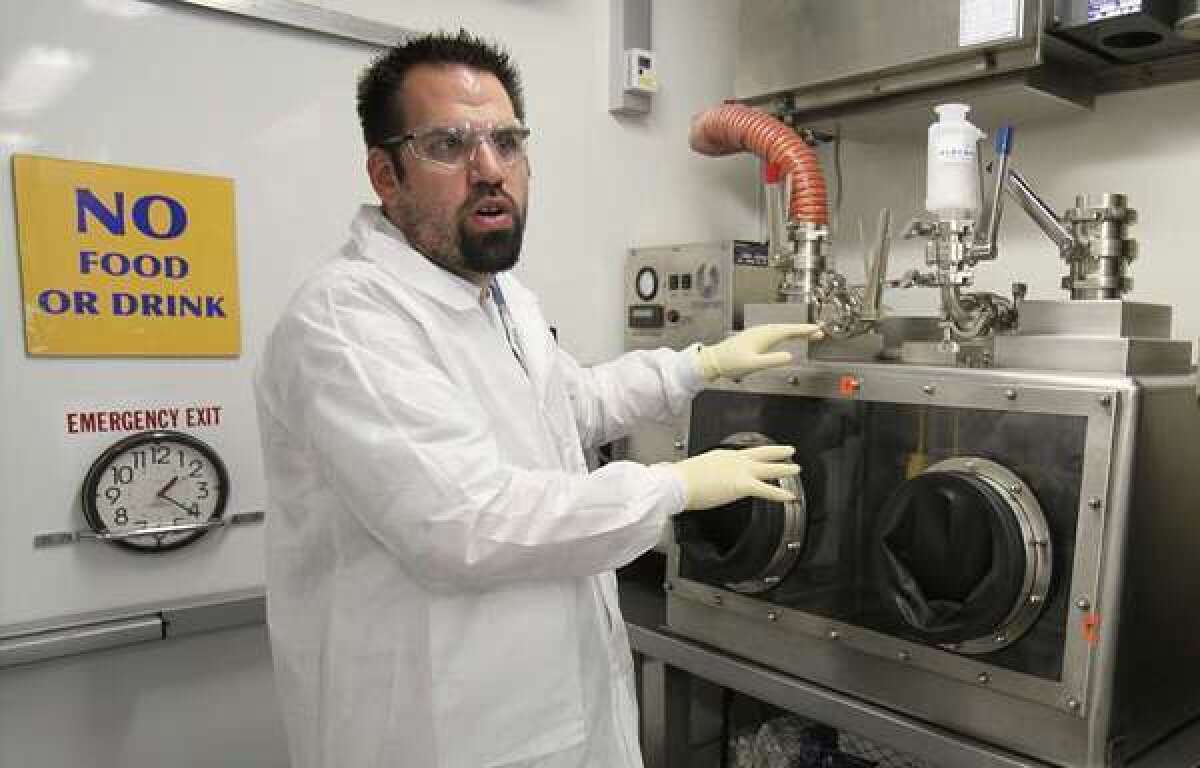 Mobile lab manager Thomas Bunt works at the Lawrence Livermore National Laboratory. The mobile lab is a roving tool, part of the airborne pathogen early warning system known as Biowatch.