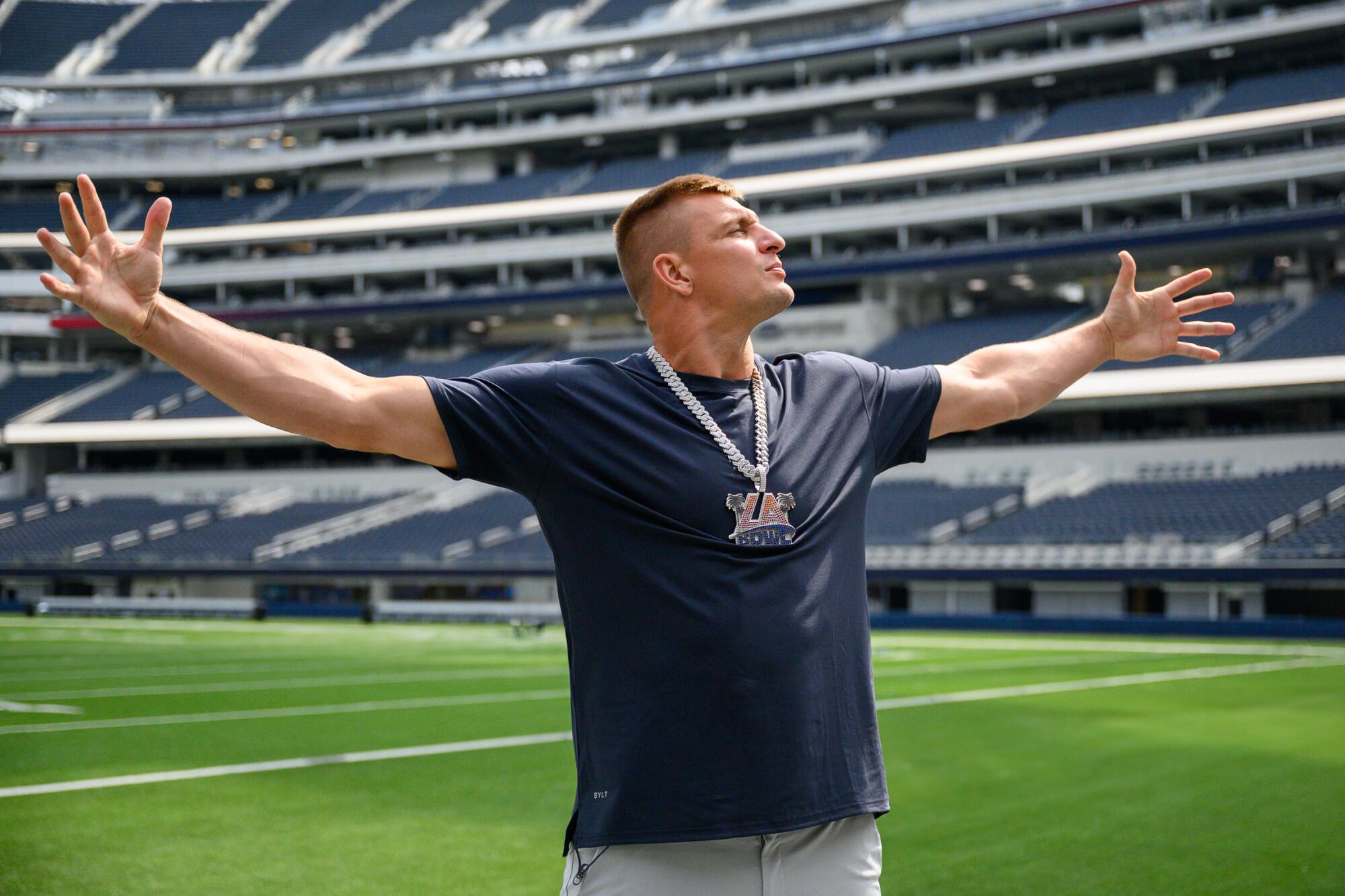 Former NFL tight end Rob Gronkowski stands on the field at SoFi Stadium
