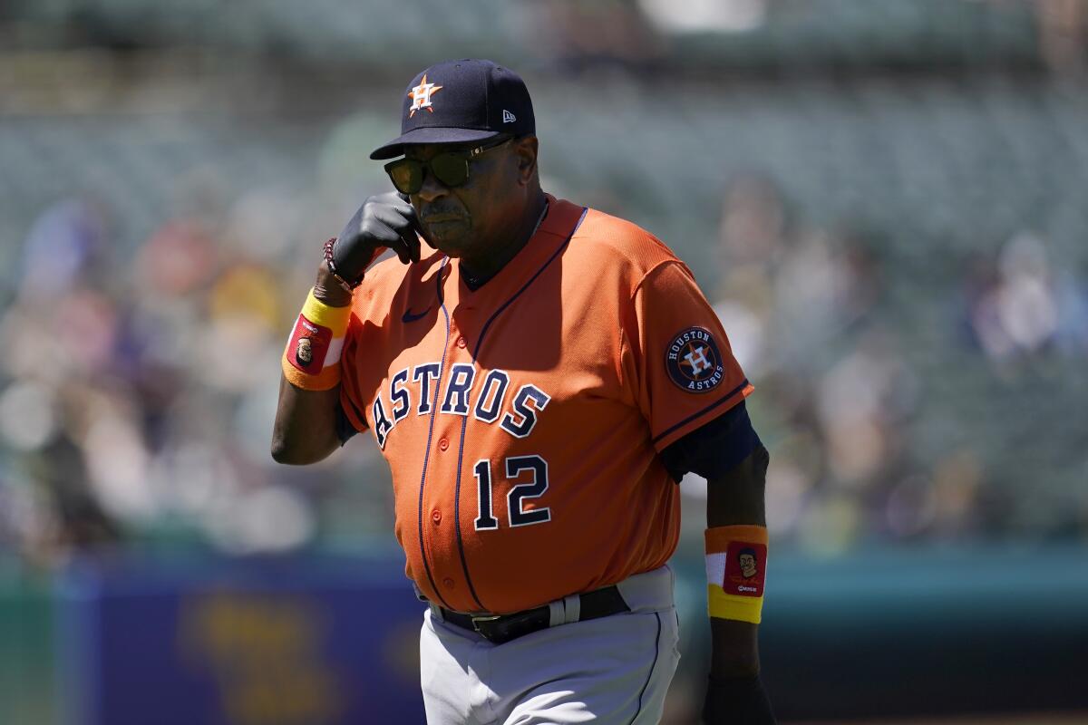 Houston Astros manager Dusty Baker Jr. walks toward the dugout after making a pitching change during the seventh inning of his team's baseball game against the Oakland Athletics in Oakland, Calif., Wednesday, July 27, 2022. (AP Photo/Jeff Chiu)