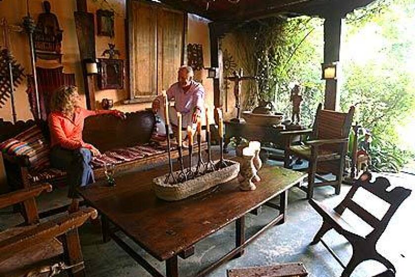 Outdoor rooms can be as decorative and intimate as anything indoors. Gail Dodge Altman and Charles Boswell kick back in a tin-roofed backyard retreat in their Hollywood home. The room is framed by Spanish colonial arches and furnished with farmhouse antiques, architectural elements and religious icons from Guatemala. Its mostly a space for entertaining, they say, though our son likes to escape the house and hang out here.