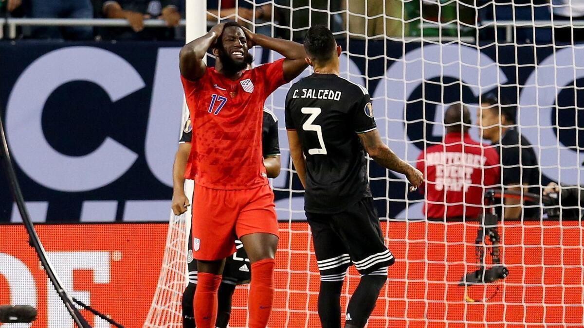 Jozy Altidore reacts after missing a shot in the first half against Mexico.