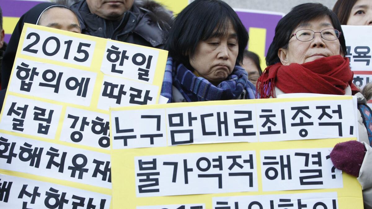 South Korean supporters of former "comfort women" gather in front of the Ministry of Foreign Affairs in Seoul on Wednesday.