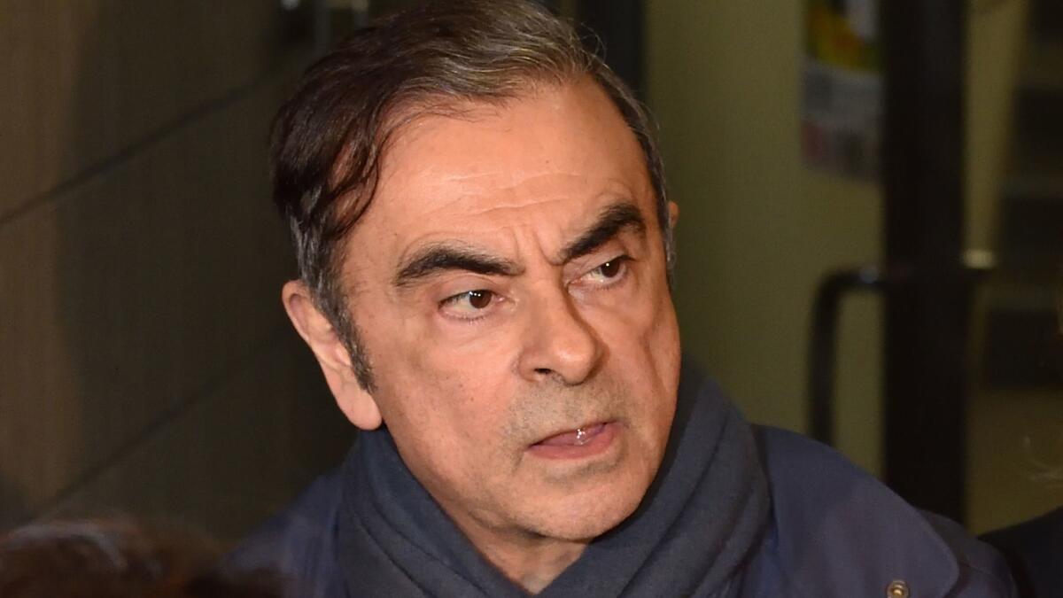 Former Nissan Chairman Carlos Ghosn leaves his lawyer's office in Tokyo on Wednesday. He was arrested hours later.