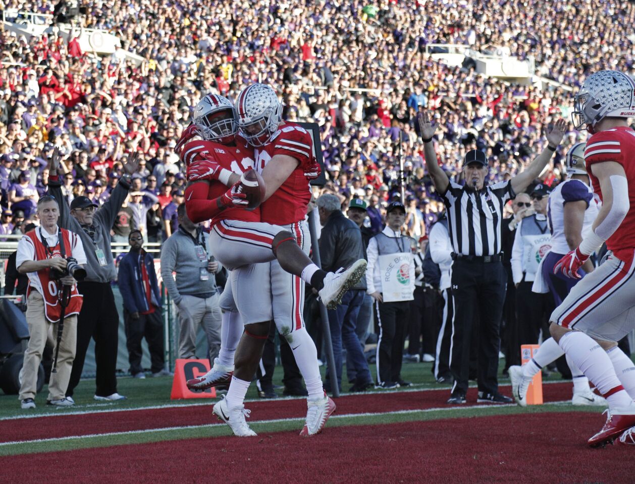 Ohio State tight end Rashod Berry (13) celebrates his touchdown with tight end Luke Farrell (89) against Washington late in the second quarter at the Rose Bowl on Jan. 1.