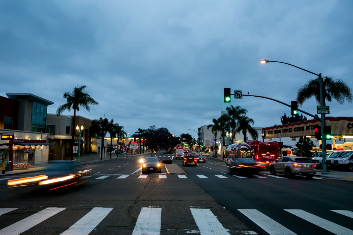 Cars drive down El Cajon Boulevard in the Normal Heights neighborhood of San Diego on June 2, 2019.