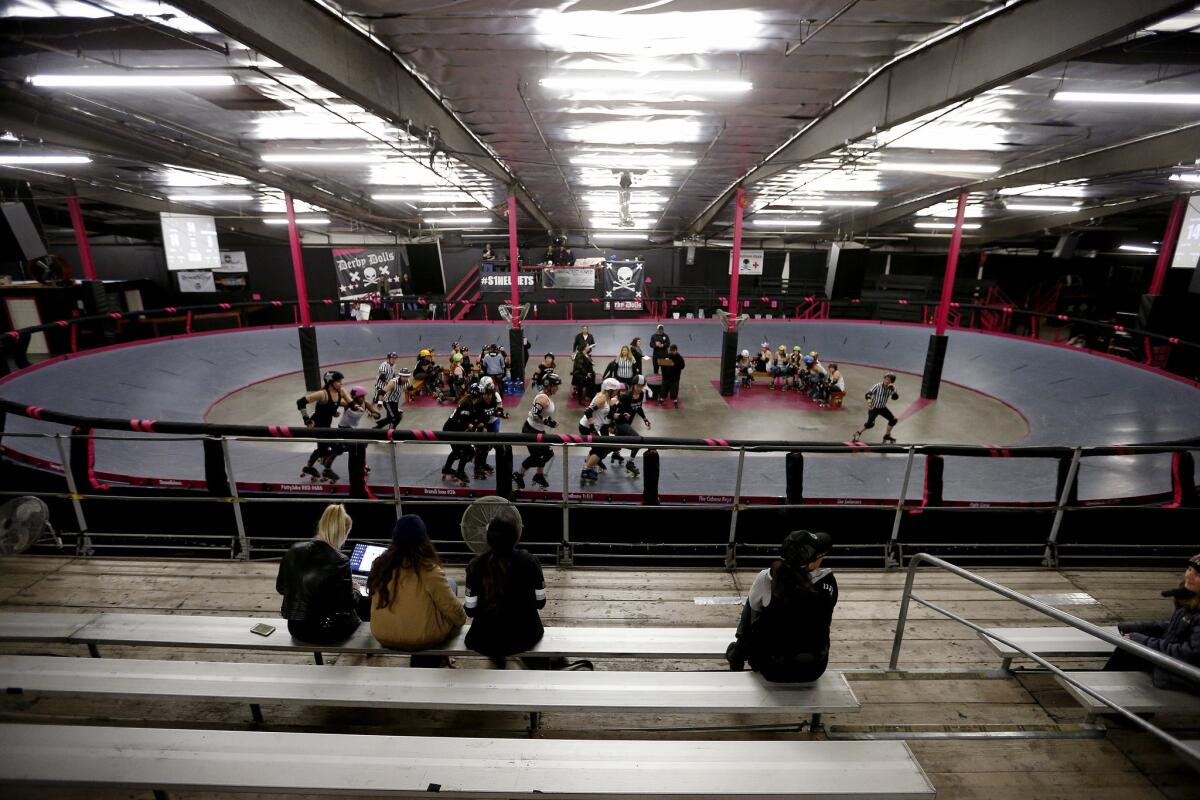 Derby Dolls, an all-female, banked track roller derby league, holds a scrimmage against Beach Cities in Los Angeles on Jan. 4.
