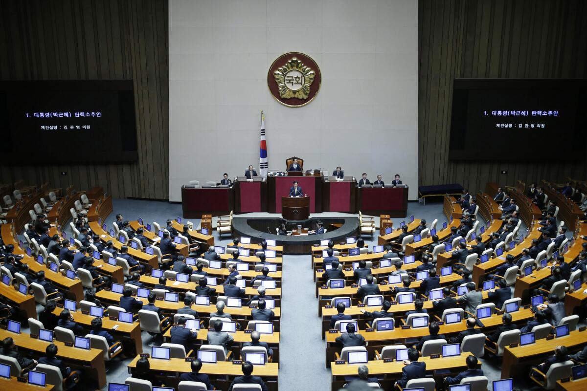 South Korea's lawmakers attend a plenary session to vote on the impeachment bill of President Park Geun-hye at the National Assembly in Seoul.