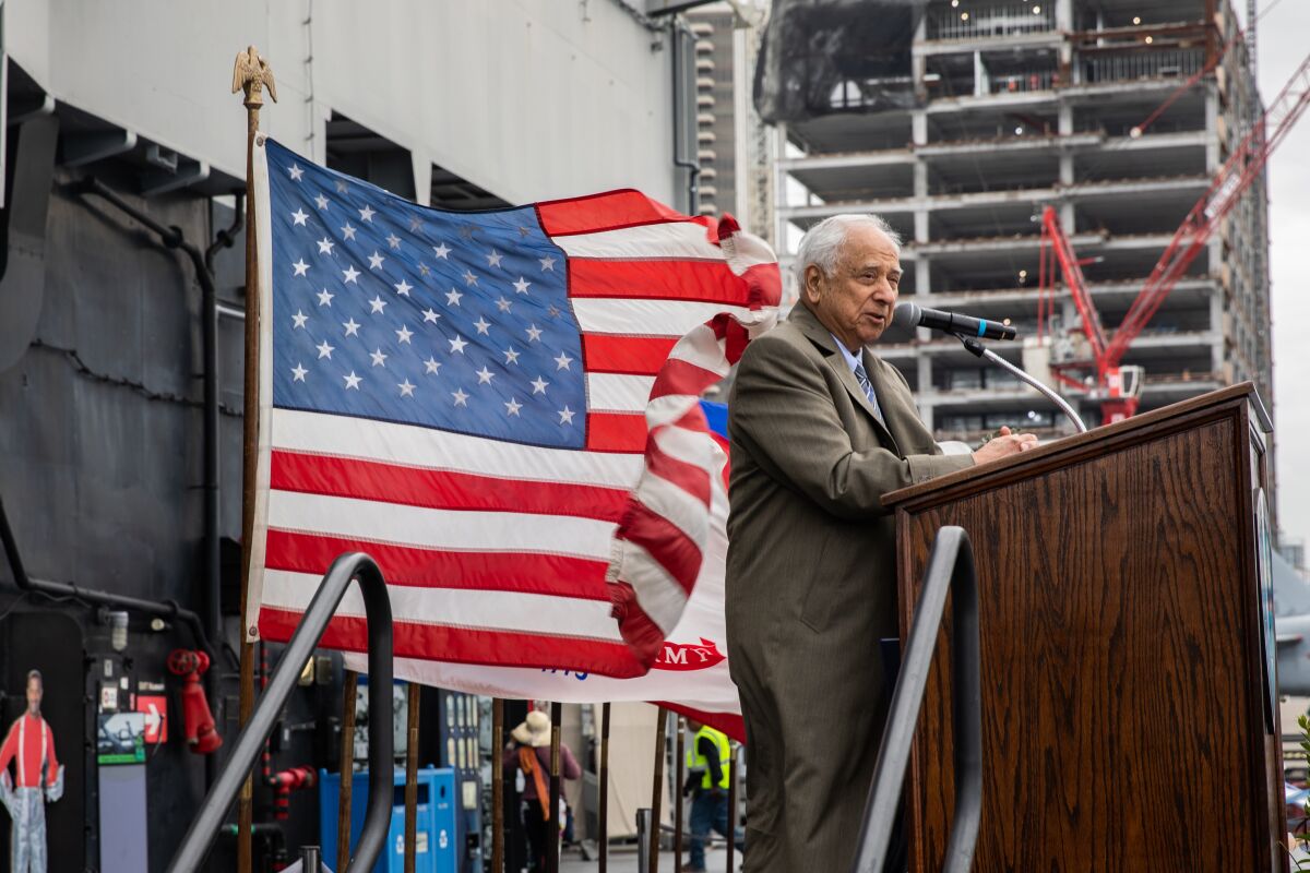 Retired Navy Cmdr. Everett Alvarez speaks at a Vietnam War event on the USS Midway Museum.