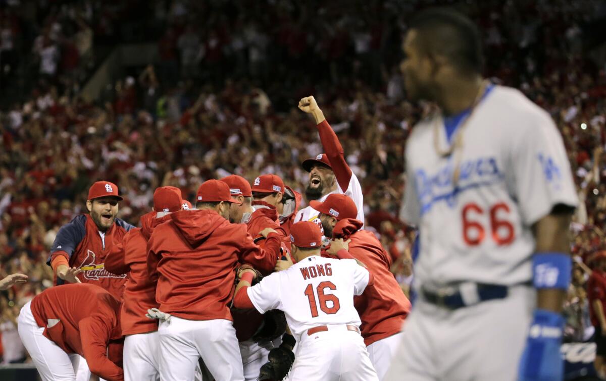 St. Louis Cardinals players celebrate after their 3-2 win over Los Angeles Dodgers in Game 4 of the 2014 NLDS.