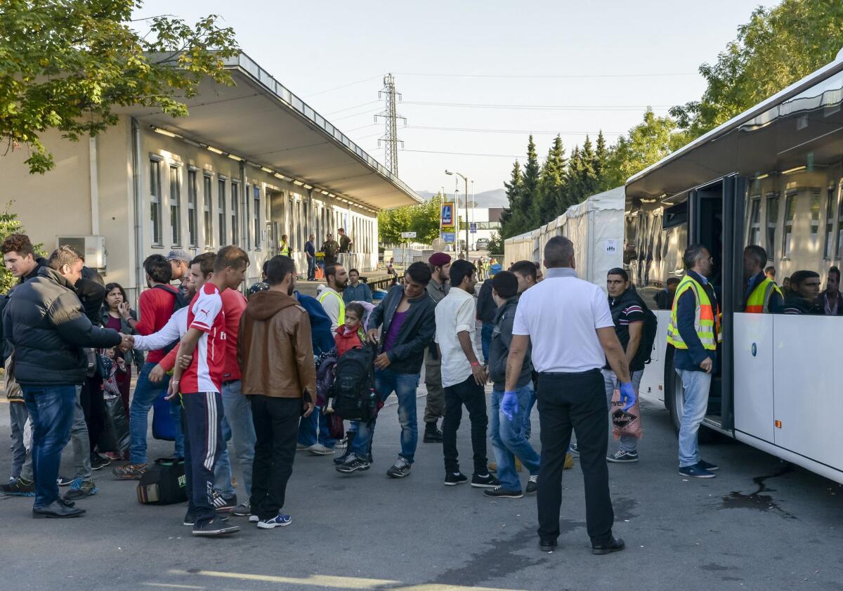 New migrants arrive at a refugee camp located in the Austrian city of Salzburg, near the German border, on Oct. 2.