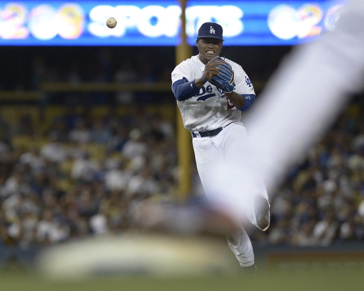 Dodgers shortstop Hanley Ramirez makes a throw to first base during the seventh inning of the Dodgers' 3-2 win over the San Francisco Giants.