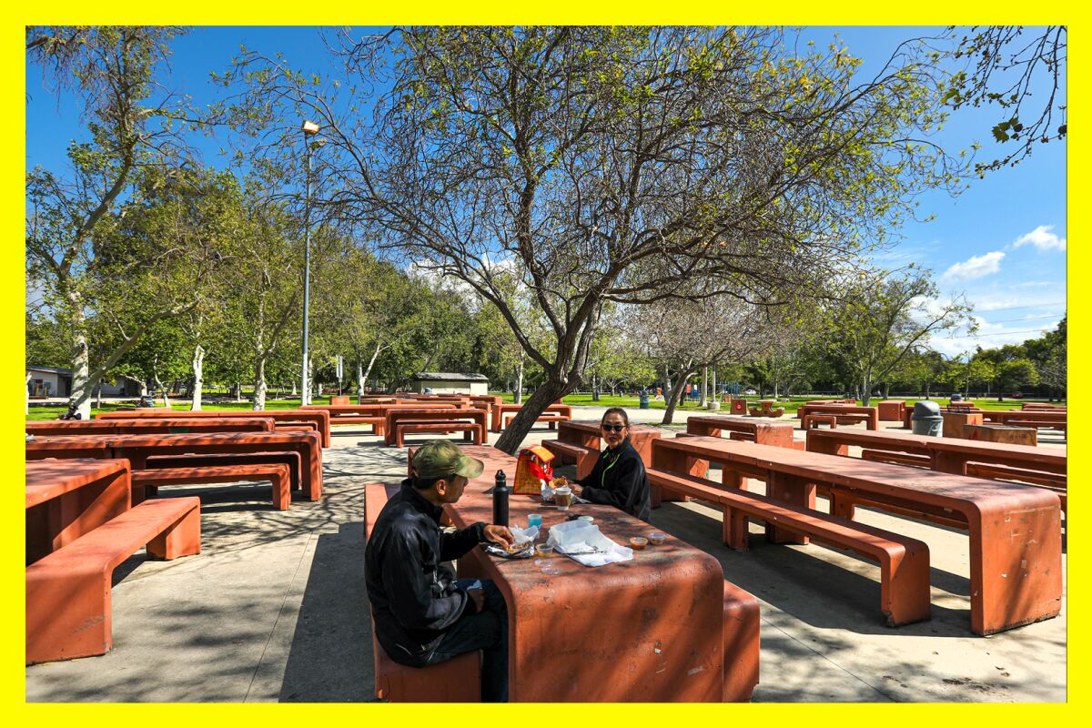 Two people have lunch at Crystal Springs Picnic area in Griffith Park.