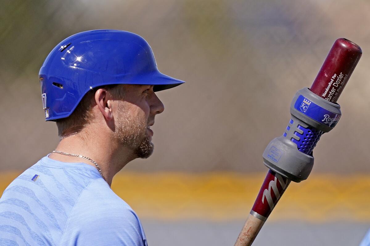 Kansas City Royals' Hunter Dozier gets ready to bat during spring training baseball practice Monday, Feb. 22, 2021, in Surprise, Ariz. (AP Photo/Charlie Riedel)