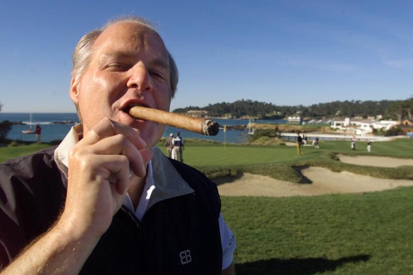 Rush Limbaugh puffs on a VSG cigar while golfing at Pebble Beach