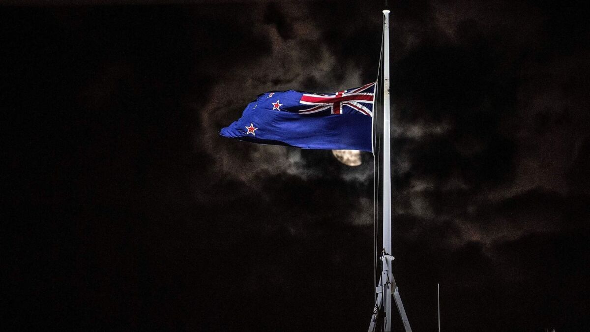 The New Zealand national flag is flown at half-mast on a Parliament building in Wellington on March 15, 2019, after the mass-shooting at mosques in Christchurch.
