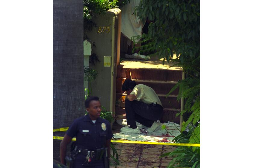 Nicole Brown Simpson's body was found outside her home at 875 S. Bundy Drive in Brentwood. Police examine the area where her body was found.