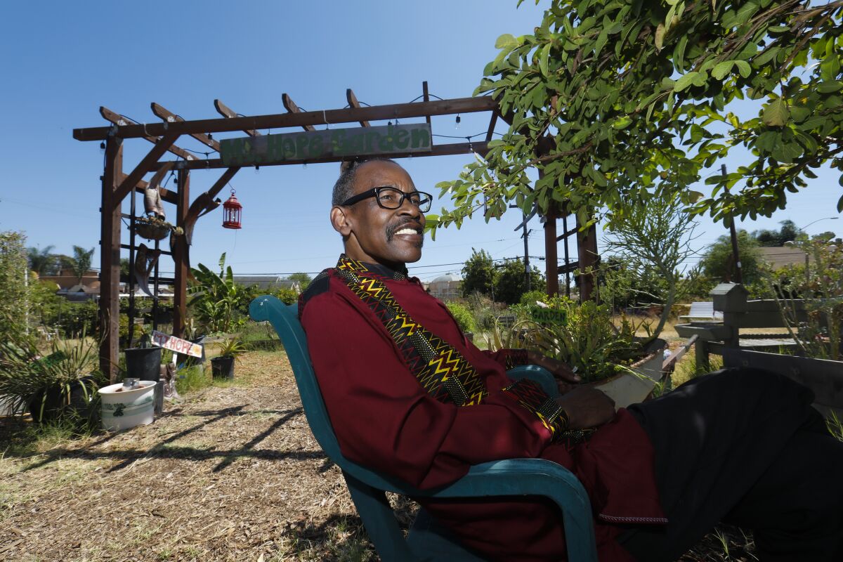Community activist Robert Tambuzi takes a moment to relax at the Mount Hope Community Garden.