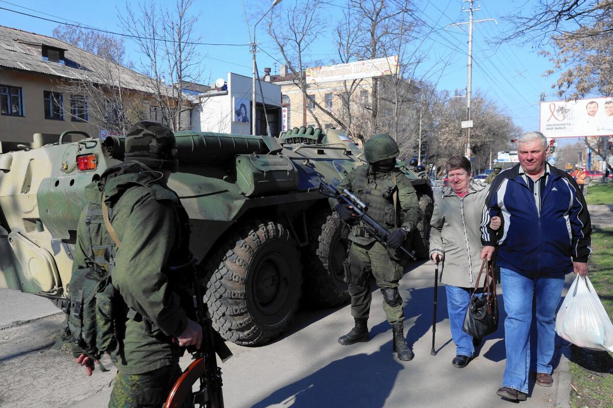 Russian soldiers patrol in Simferopol, the Crimean regional capital.