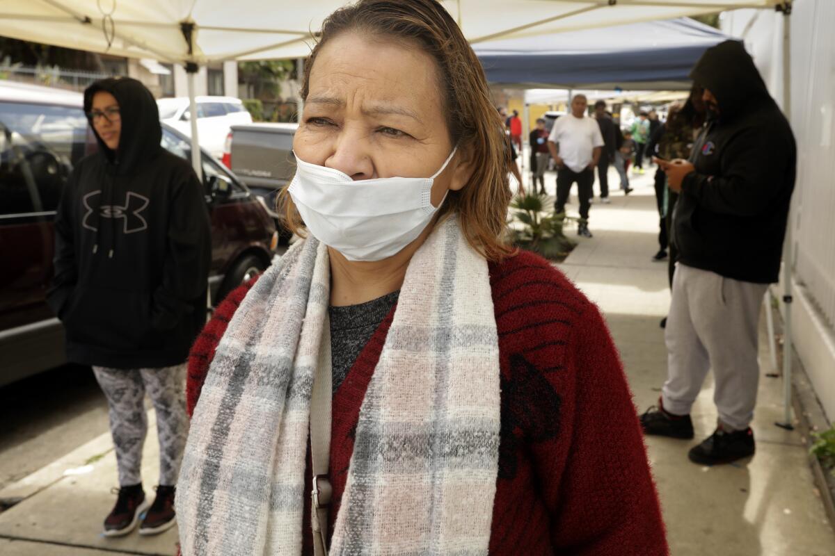 A woman wearing a medical face mask