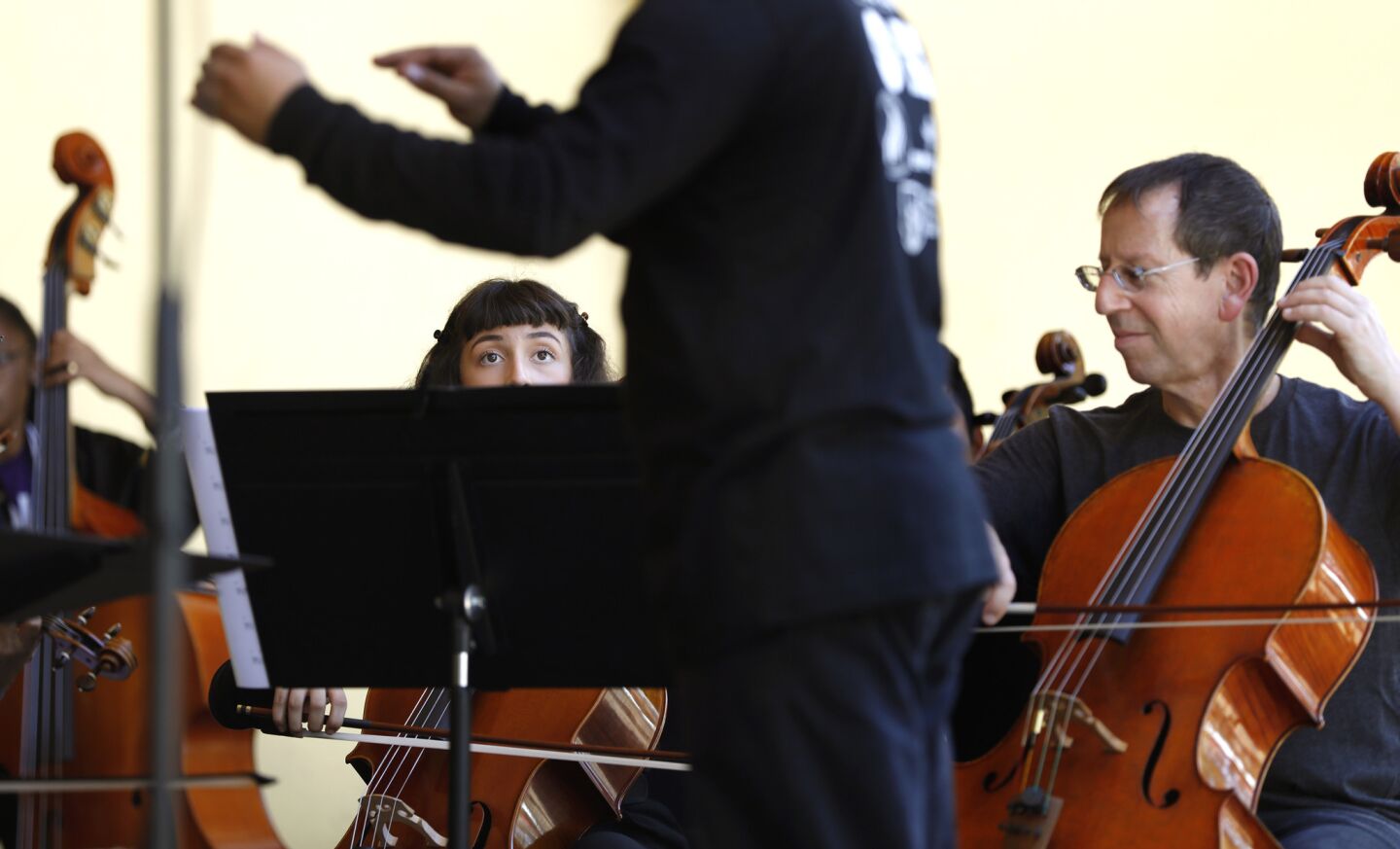 Madeleine Rubio of Youth Orchestra Los Angeles and Barry Gold, a member of the L.A. Phil, perform at MacArthur Park.