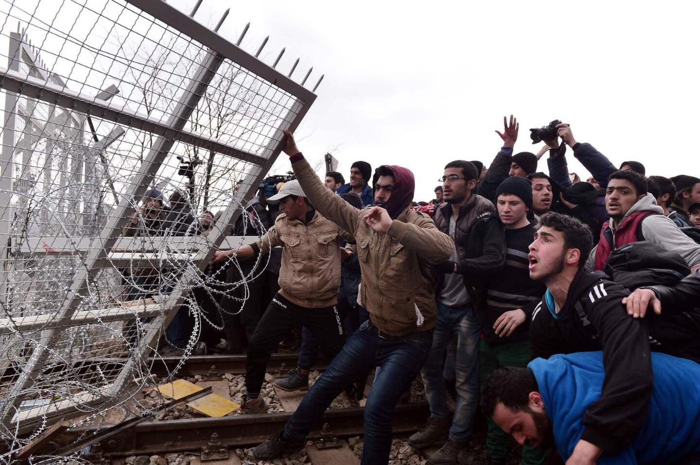 Refugees break into the Greece-Macedonian borders during their protest demanding the opening of the borders near the village of Idomene.