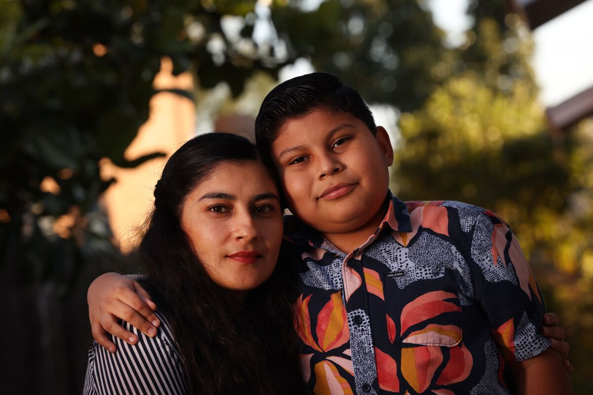 A woman and a boy outdoors