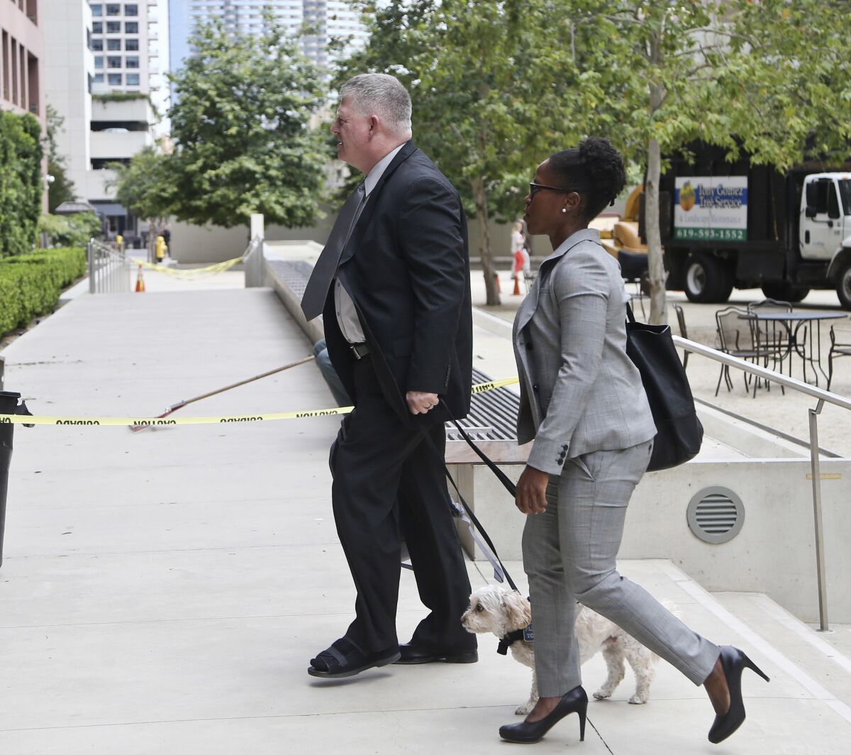 FILE - Rear Adm. Robert Gilbeau enters the federal courthouse in San Diego on Thursday, June 9, 2016. Gilbeau pleaded guilty Thursday to lying to federal authorities investigating a $34 million fraud scheme involving a Malaysian contractor known as "Fat Leonard." Dozens of U.S. Naval officers have admitted to being bought off by a gregarious, rotund Malaysian defense contractor known as "Fat Leonard" who obtained military secrets. (AP Photo/Lenny Ignelzi,File)