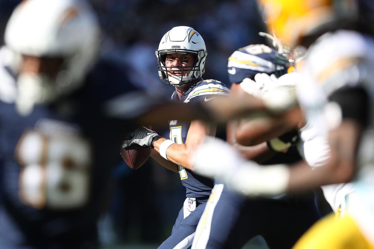 Chargers quarterback Philip Rivers looks to pass against the Green Bay Packers.