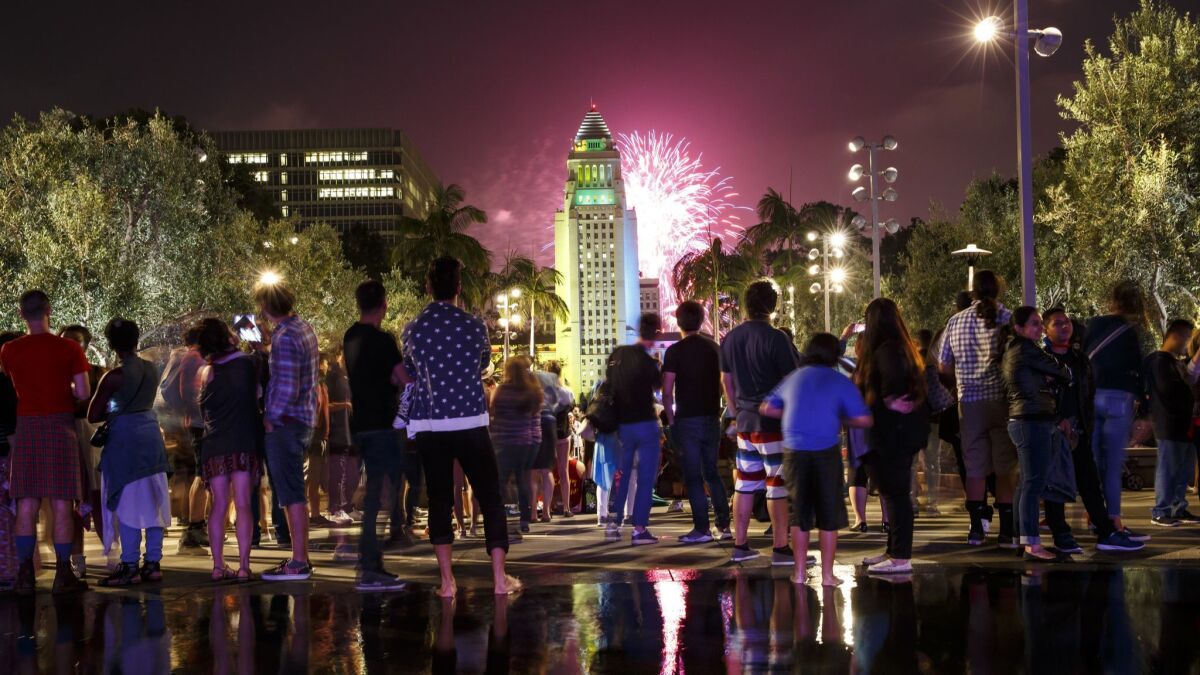 Fireworks light up the Los Angeles skyline at Grand Park.