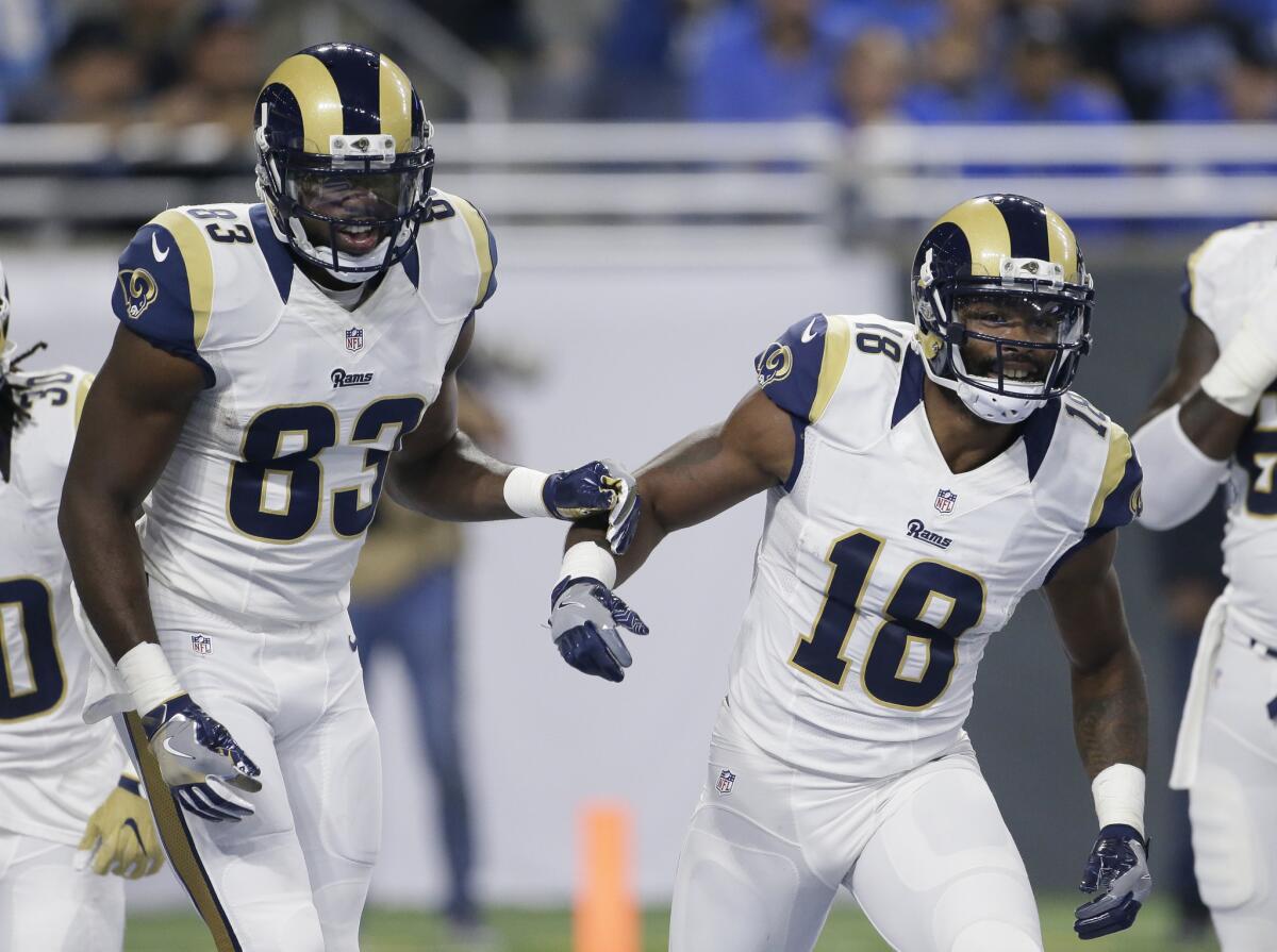 Rams wide receiver Brian Quick (83) celebrates with wide receiver Kenny Britt (18) after scoring against the Lions during the first half on Oct. 16.