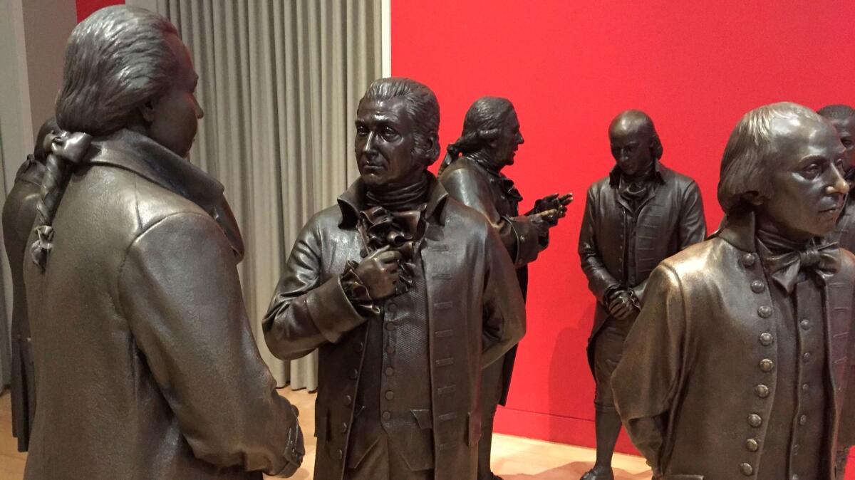 Life-size bronze sculptures of the signers of the U.S. Constitution in the Signers' Hall at the National Constitution Center in Philadelphia.