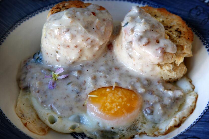 A breakfast treat, freshly baked biscuits and gravy over a poached egg at Sqirl Cafe.