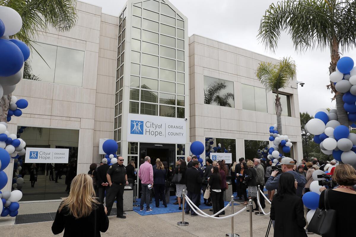 Tuesday's grand-opening ceremony for City of Hope's 12,500-square-foot Newport Beach clinic draws a crowd to 1601 Avocado Ave.