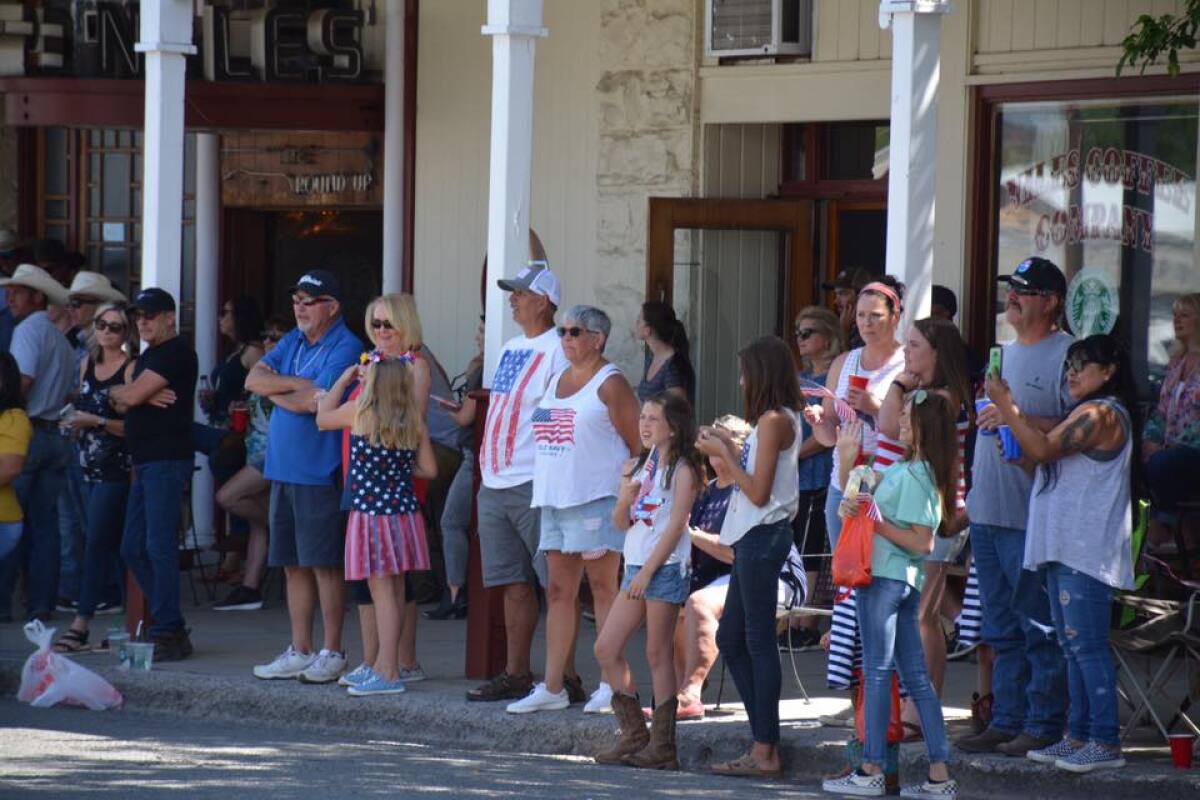 Modoc County residents watch a Fourth of July parade. Most don't wear face masks despite the threat of the coronavirus.