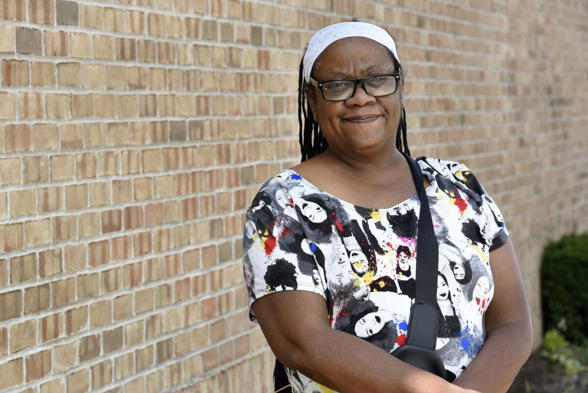Regina Howard poses for a photo in Southfield, Mich., Friday, July 30, 2021. Lakeshore Legal Aid successfully helped Howard receive $24,550 in federal funds to pay for 15 months of rent. (AP Photo/Jose Juarez)