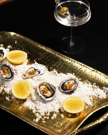Enjoy passed canapés such as oysters with champagne gelee at Lillie's in the historic Culver Hotel.