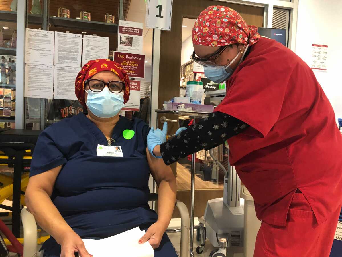 Maria Saravia gets vaccinated at Keck Hospital of USC.