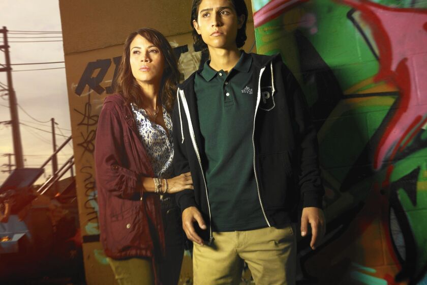 Lorenzo James Henrie plays Chris, the son of Liza Ortiz (Elizabeth Rodriguez) in “Fear the Walking Dead,” but he’s not Latino.