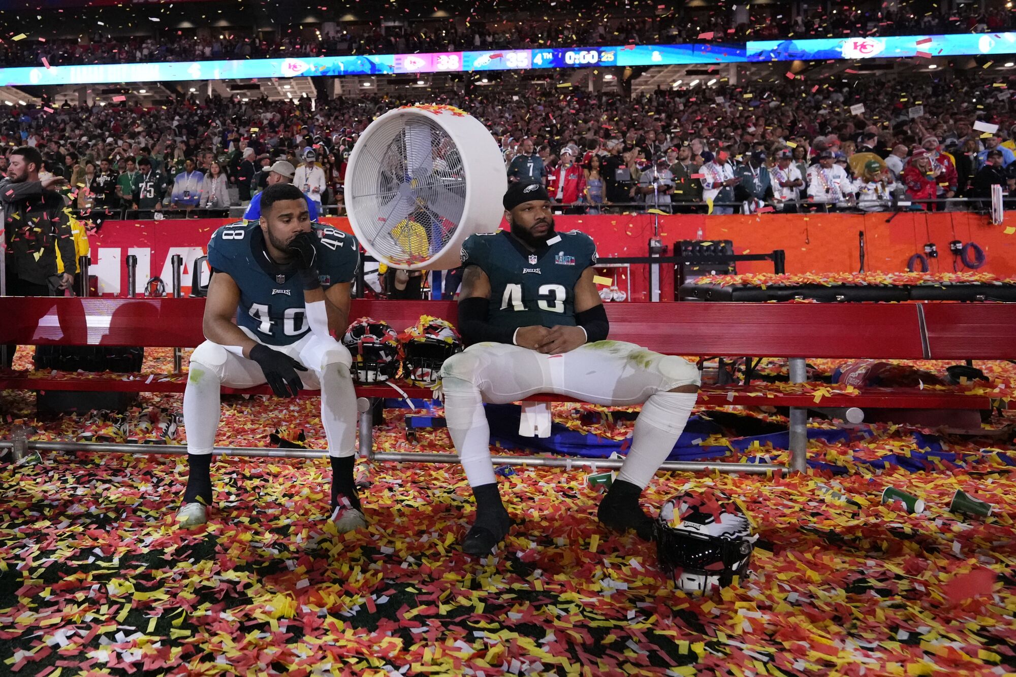 Eagles linebackers Patrick Johnson and Kyzir White sit on the bench after losing to the Chiefs in the Super Bowl