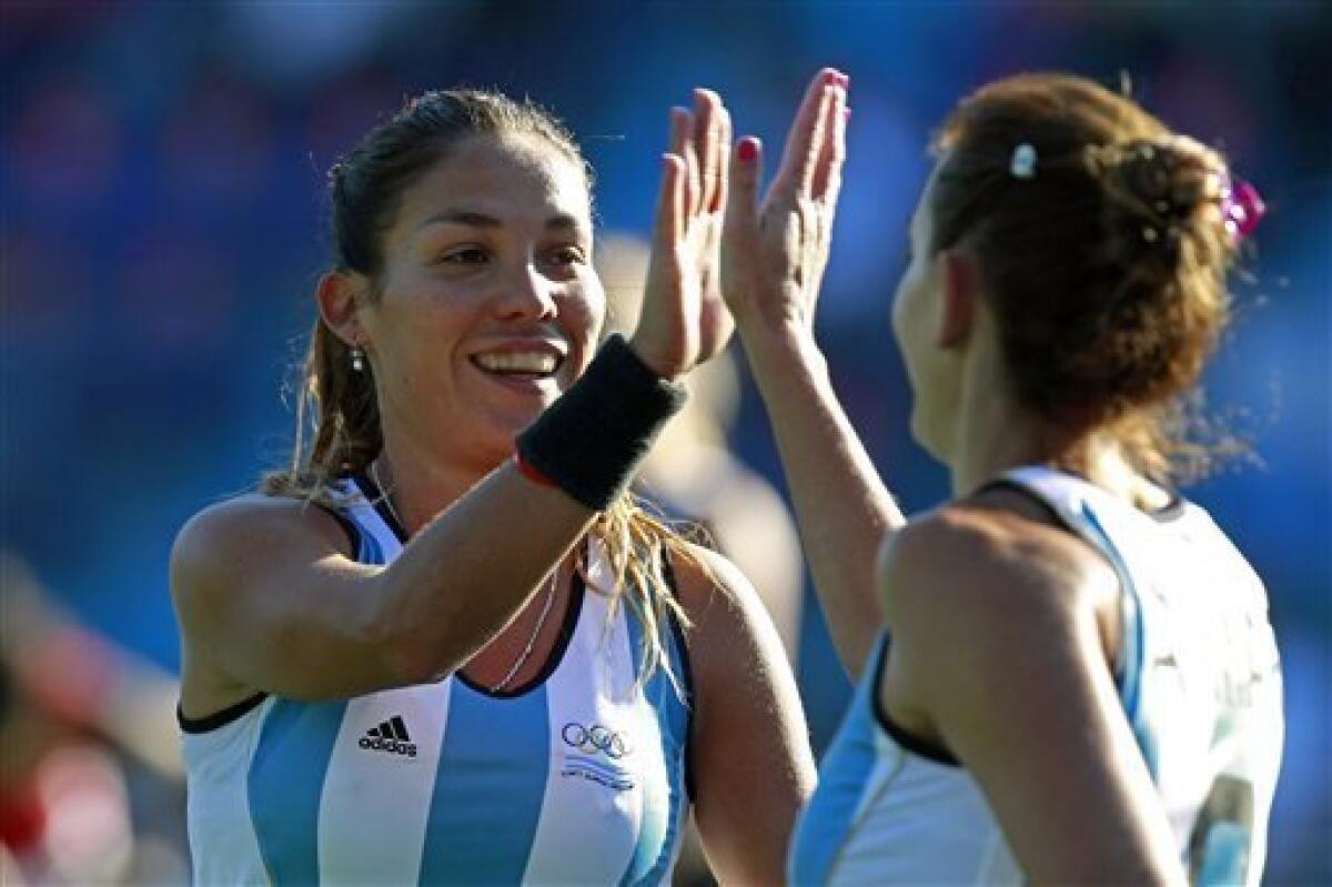 Argentina's Luciana Aymar celebrates scoring the winning goal