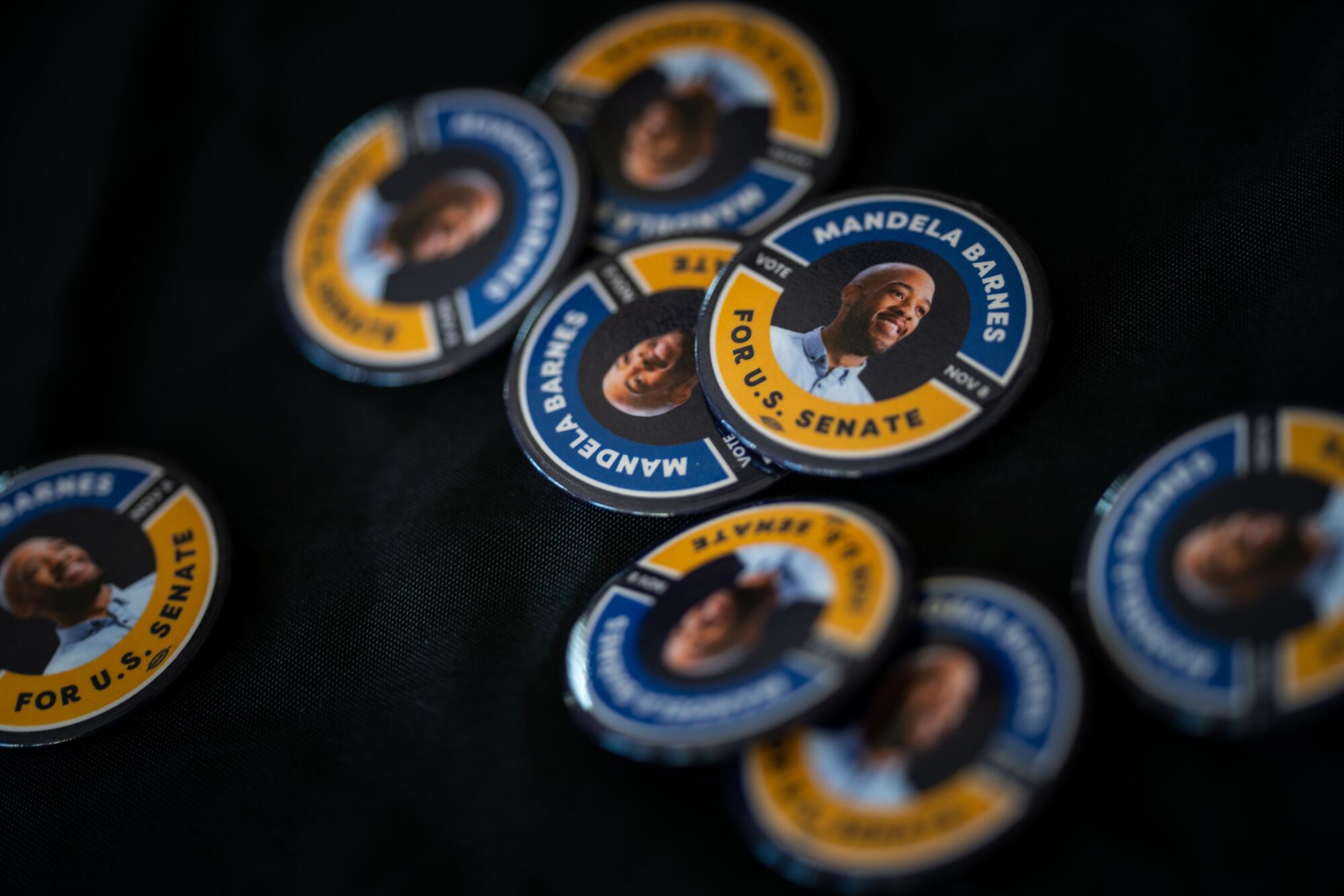 Campaign buttons are seen on a table as Democratic candidate for U.S. Senate Mandela Barnes