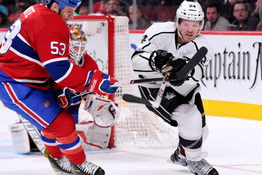 Kings forward Colin Fraser makes a pass against Montreal's Ryan White during a game last season.