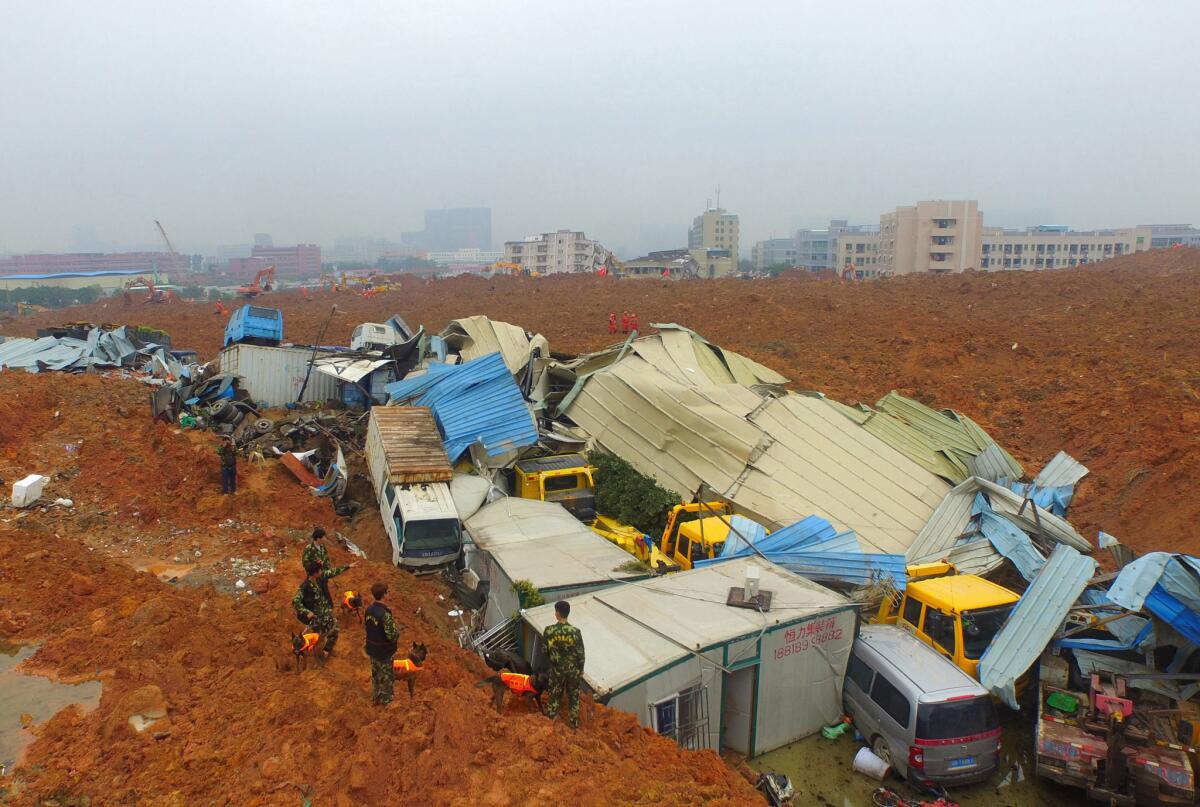 Chinese rescuers work at the site of a landslide that hit an industrial park in Shenzhen in south China's Guangdong province.