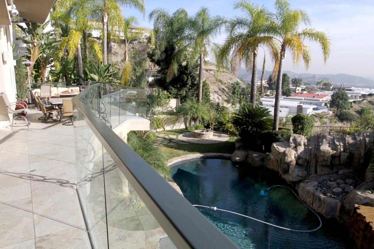 The backyard of Koko Tabibzadeh's home includes a pool and offers a view of Glendale.