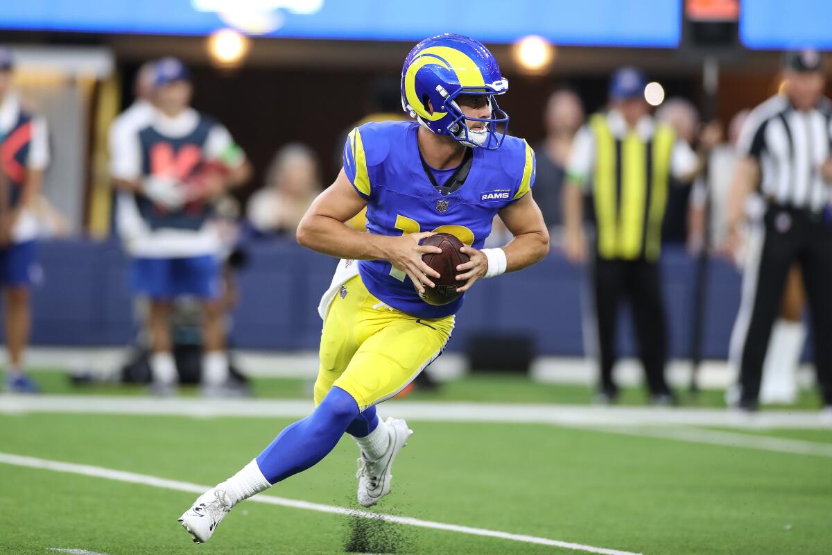 Rams quarterback Stetson Bennett looks to pass during a preseason game against the Chargers.